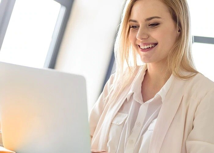 happy woman with laptop