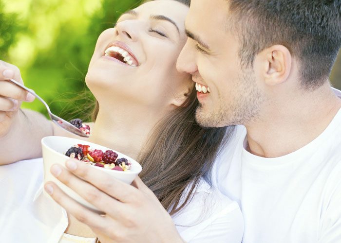 couple eats granola