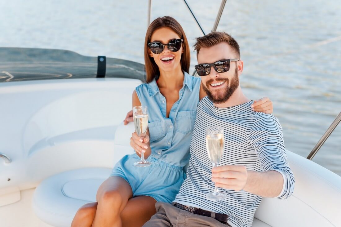 couple drinks champagne on the yacht