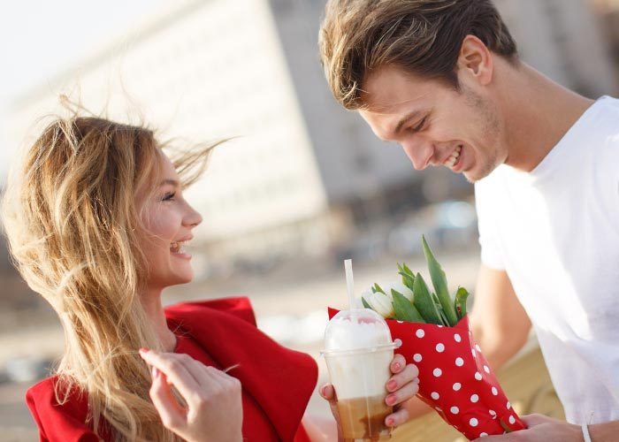 man gives the girl tulips