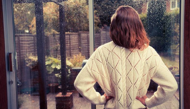 woman watching through the window