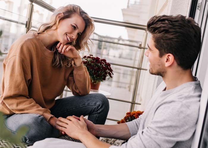 woman with man on the balcony