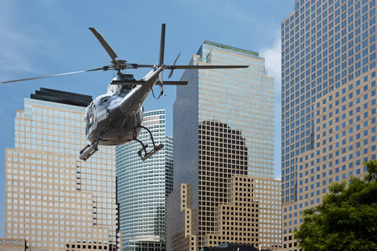 Helicopter flies under the city