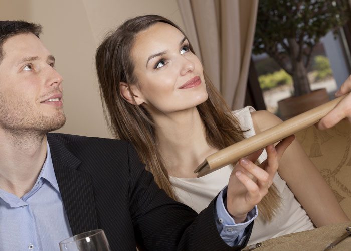 couple are paying in a restaurant