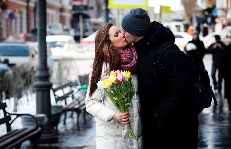 couple with flowers outdoors