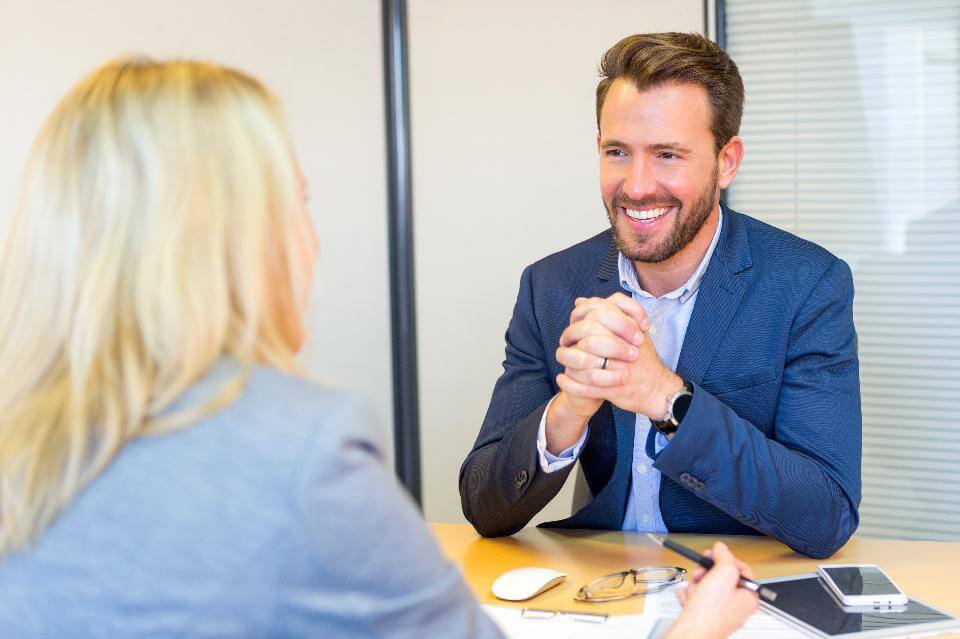 happy man in office with woman