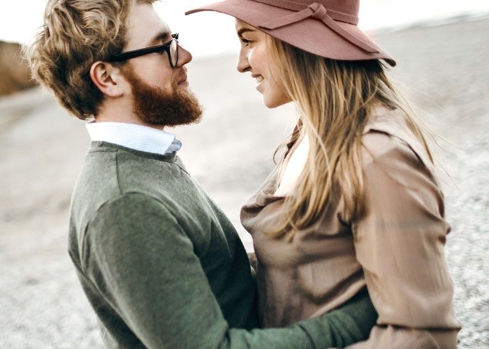 couple on the beach in autumn