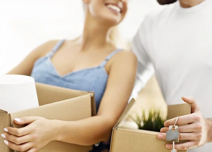 happy couple with boxes