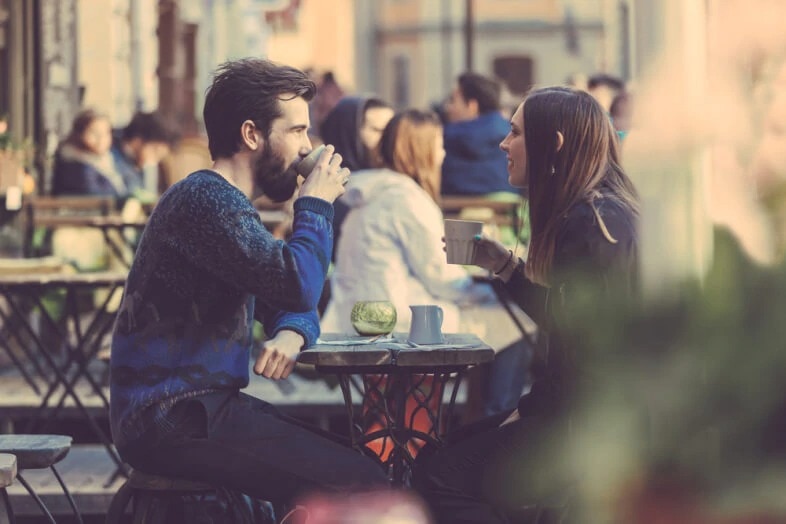 couple drinks coffe on a outdoor date