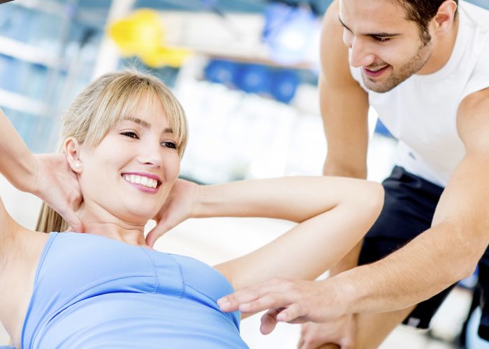 man and woman florting at the gym