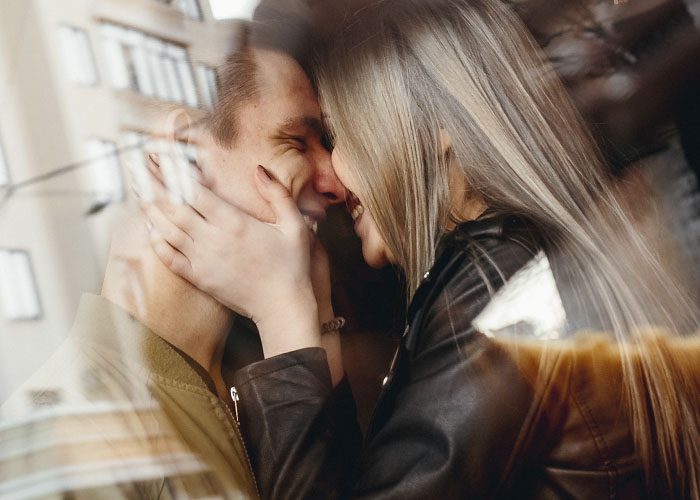 cute couple behind the glass