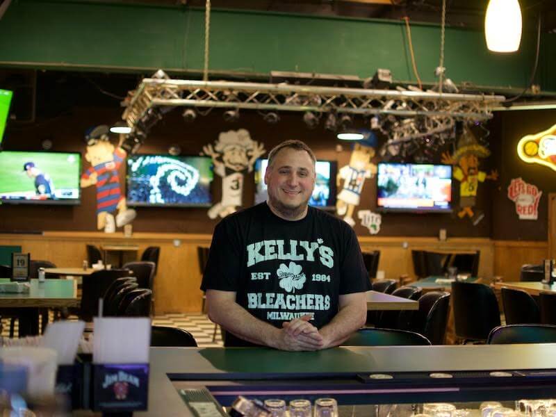 happy man in Kelly’s Bleachers