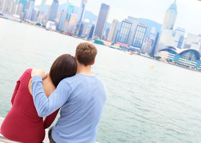 couple hugs on the shore