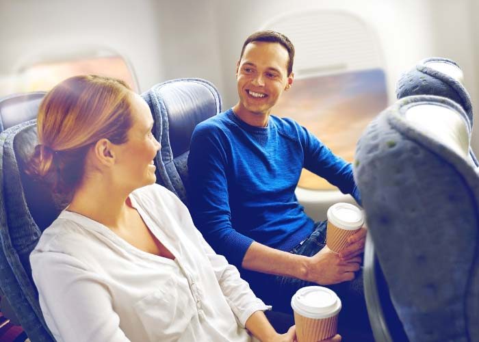 man flirting with woman on a plane